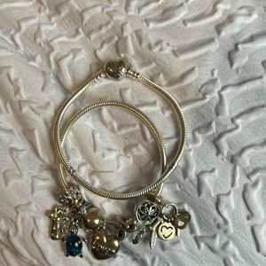 2 Pandora Charm bracelets . Never worn , Has 8 charms , Silver